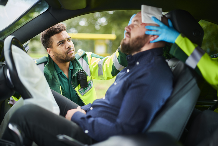 paramedics dealing with car crash